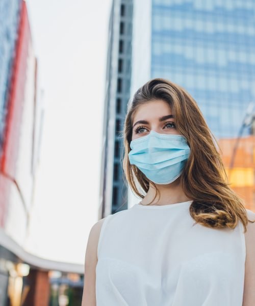 portrait of young woman with mask for protection from coronavirus outbreak